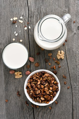 Obraz na płótnie Canvas Granola cereal and milk, top view