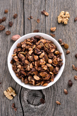 Chocolate granola on wooden background, top view