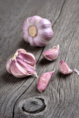 Cloves of garlic on wooden background