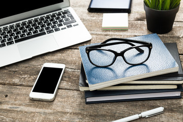Wooden table with office supplies