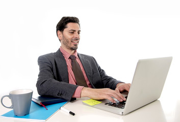 businessman working at office computer laptop looking happy sati