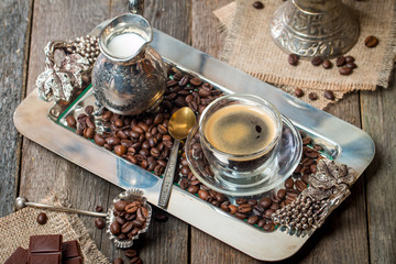 Obraz na płótnie Canvas Espresso glass cup with coffee bean