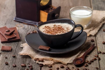 Fotobehang Kopje koffie met koffiebonen en chocolade © petrrgoskov