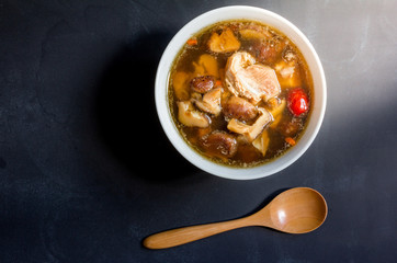 Top view, stew of pork and herbal soup, ba kut teh on black back