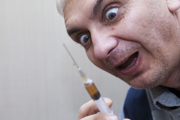 Syringe in a hand