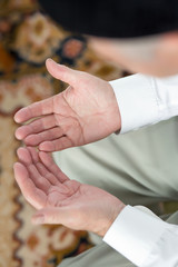 Praying hands of an old man