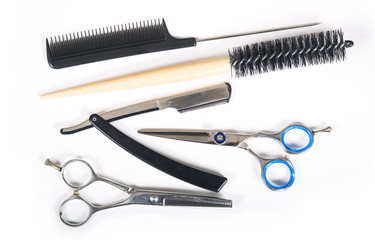 Barber or hairdresser tools on white background