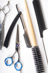 Barber or hairdresser tools on white background
