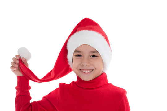 child in Santa Claus's cap smils