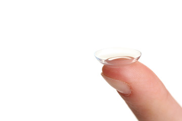 contact lens on finger isolated on white background