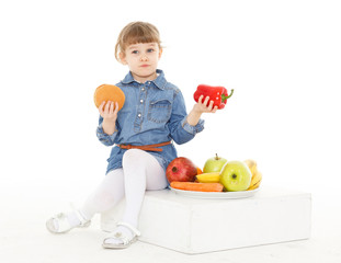 Child with hamburger and fruits.
