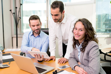 Group of business associates working together at the office