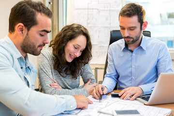 Young attractive people meeting real estate agent at the office