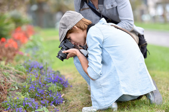 Photographers in park shooting vegetation