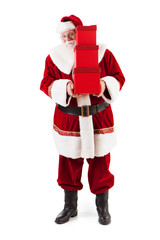 Santa Claus Peeks Around Stack Of Gifts