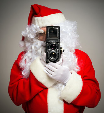 Santa using a vintage camera