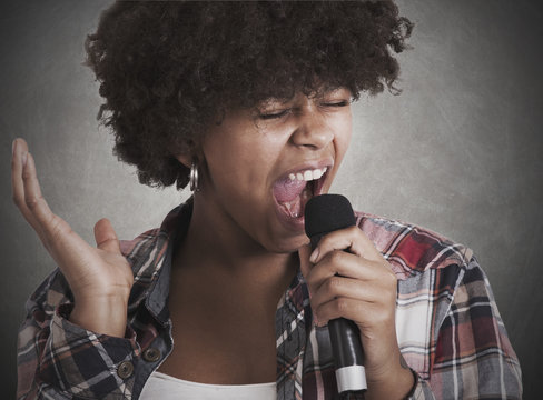 woman singing with microphone