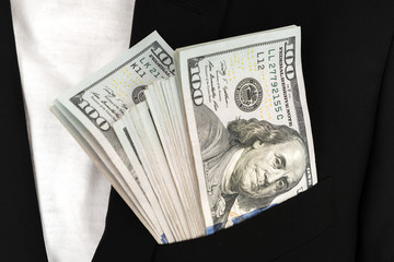 Business man Displaying a Spread of Dollar