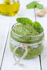 Pesto sauce on white wood boards 