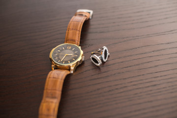 black cufflinks and watch