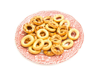 bagels on pink plate on white