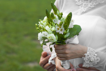bride holds bouquet