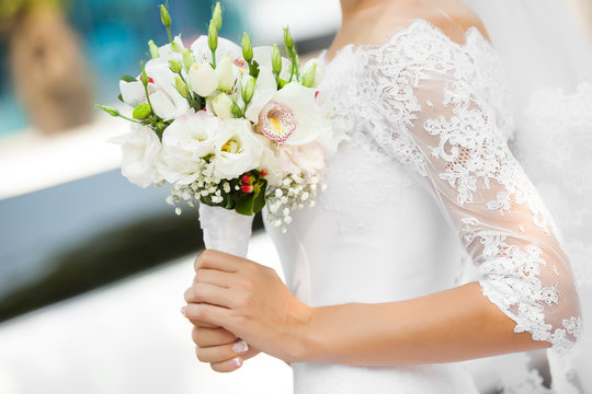 bride holds bouquet