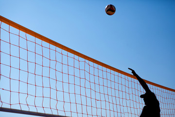 man is playing volleyball