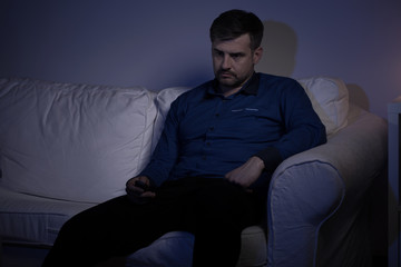 Fototapeta na wymiar Depressed man on the sofa