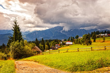 View on the High Tatra Mountains with dark clouds at background.