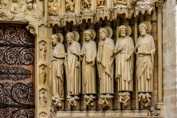 Sculptures at main entrance to cathedral Notre Dame de Paris.