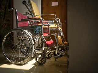 Fototapeta na wymiar alone with illness and two wheelchairs together.