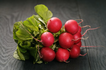 organic radishes on old oak table