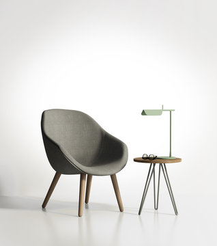 Modern grey armchair with a light green lamp