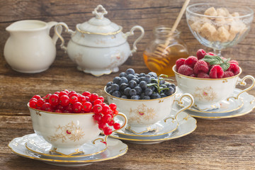 red currant, raspberry and blueberry in cups 