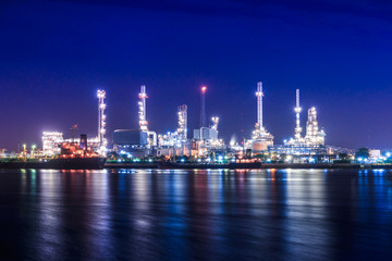Fototapeta na wymiar Oil refinery with sunset sky