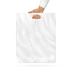 Blank plastic bag mock up holding in hand. Empty polyethylene package mockup hold in hands isolated...