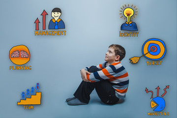 Teenage boy sitting on the floor and looking up happy smiling co