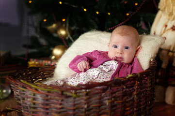 little girl under the tree on Christmas