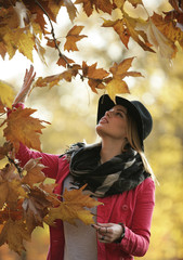 Beautiful young woman in late summer autumn in nature