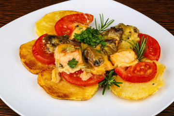 Roasted salmon with potato and tomato