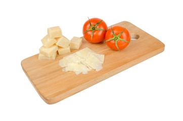 parmesan cheese, tomato on wooden board