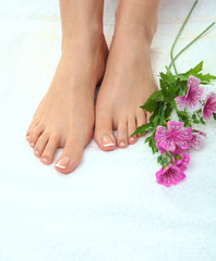 Closeup photo of a beautiful female feet with pedicure