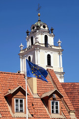 Fototapeta na wymiar Church of St. John and flag of EU, Vilnius, Lithuania