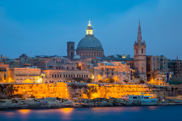 Valletta seafront skyline view as seen from Sliema, Malta.St Paul's Cathedral after sunset. - obrazy, fototapety, plakaty