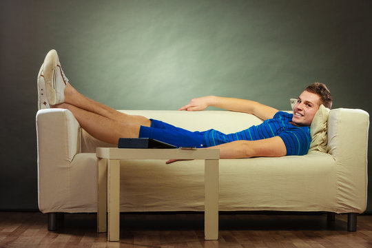 Young man relaxing on couch