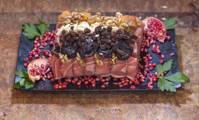 raw pork with prune nuts and pomegranate