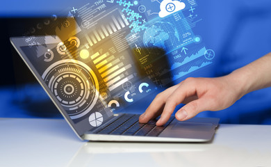 Modern notebook computer with future technology symbols