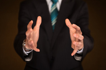 Businessman holding something