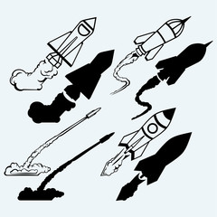 Rocket icon. Isolated on blue background. Vector silhouettes